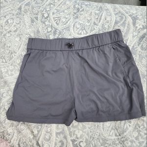 Grey lightweight athletic shorts for women.